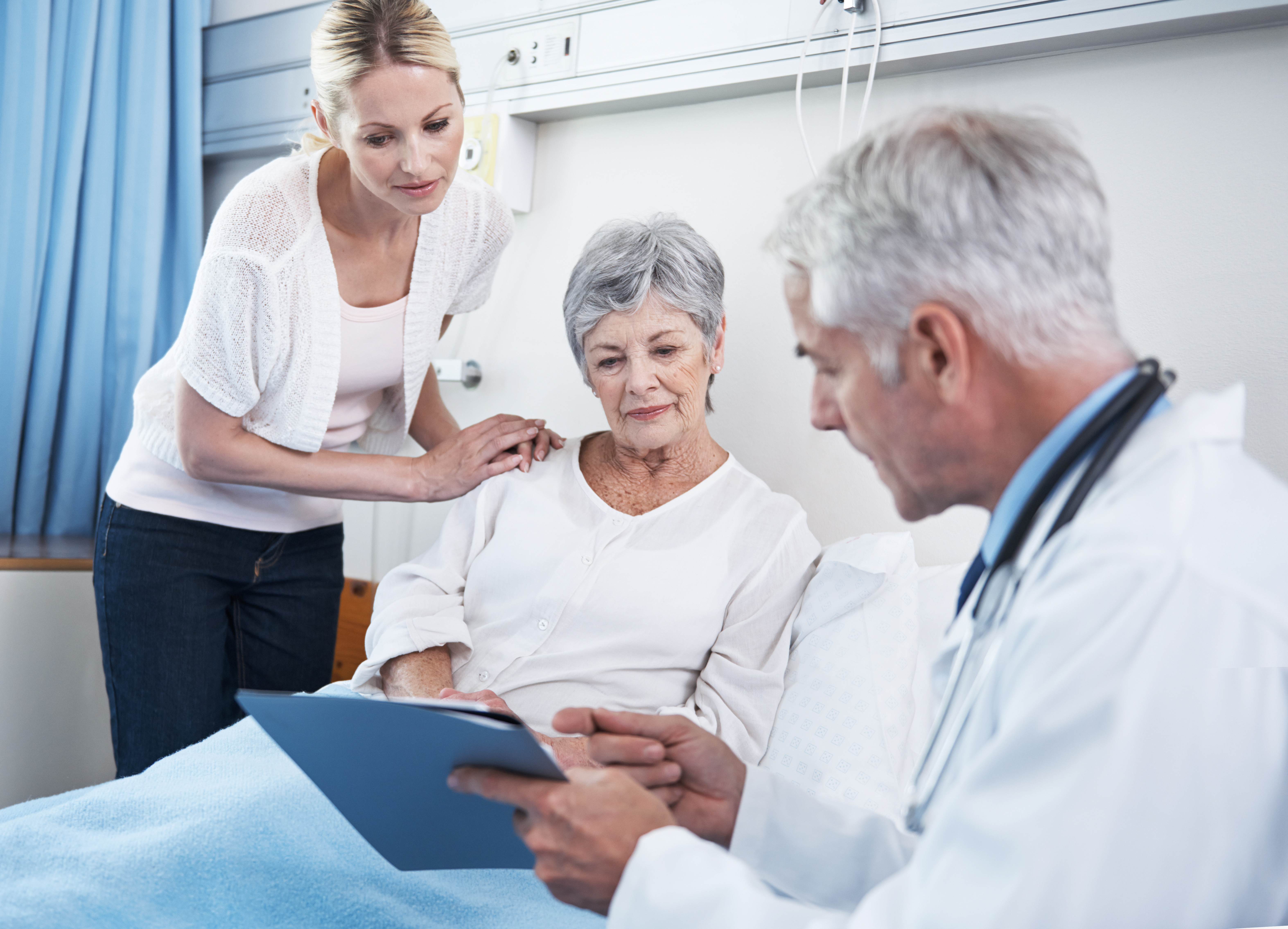 Shot of a doctor discussing a senior woman's health with her and her daughter by her side